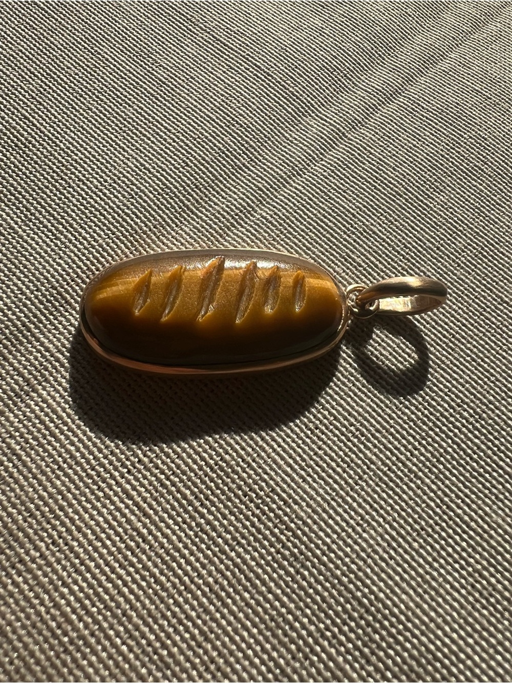 21K Hand Carved Tigers Eye Bread Pendant